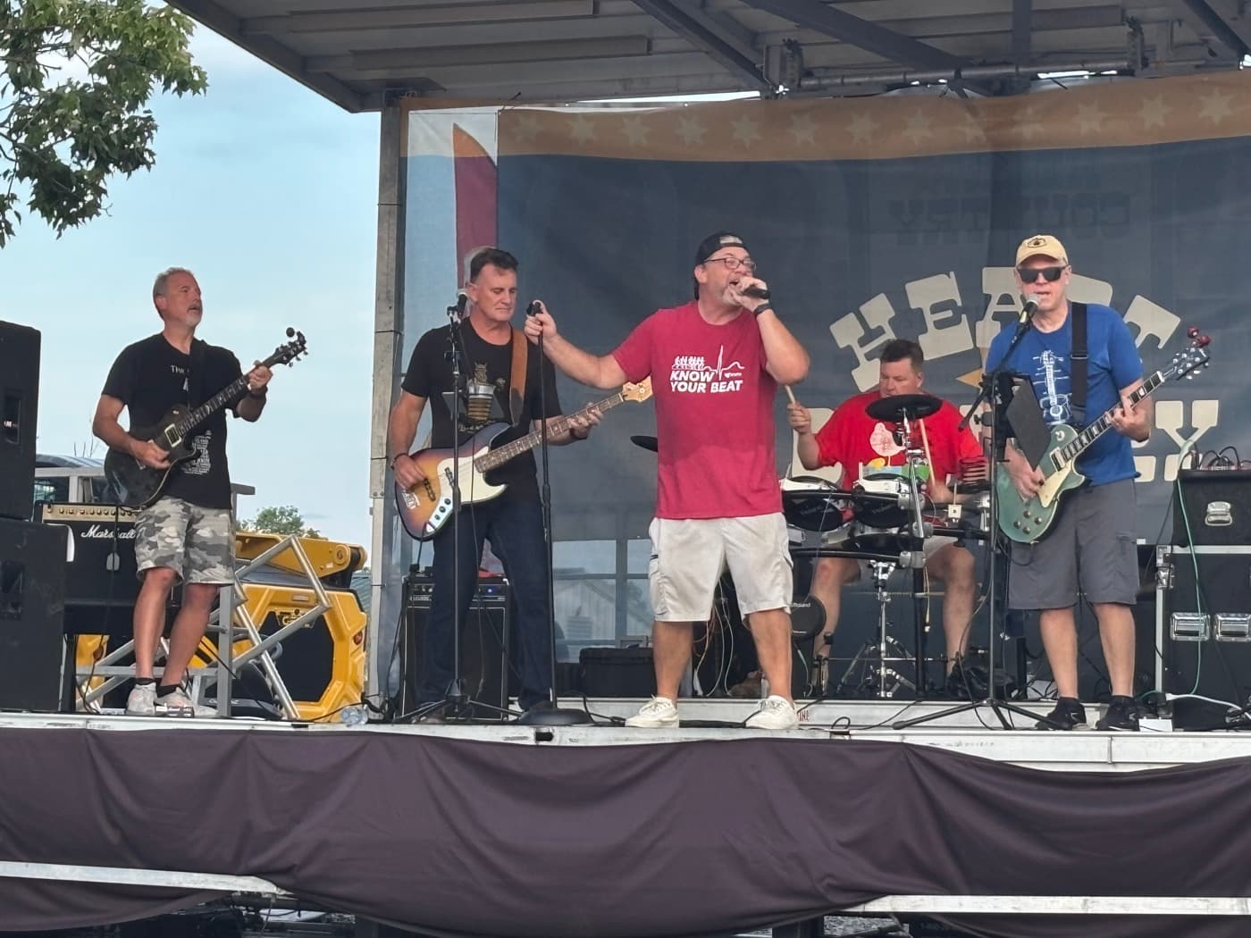 The full band mid-song on the Kenton County Fair stage