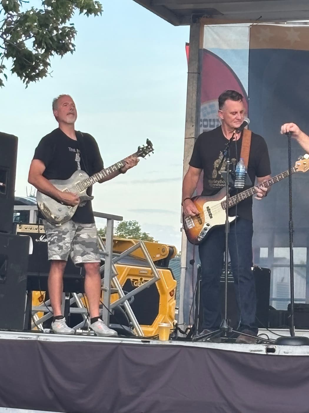 Guitarist and bassist between songs on the Kenton County Fair stage