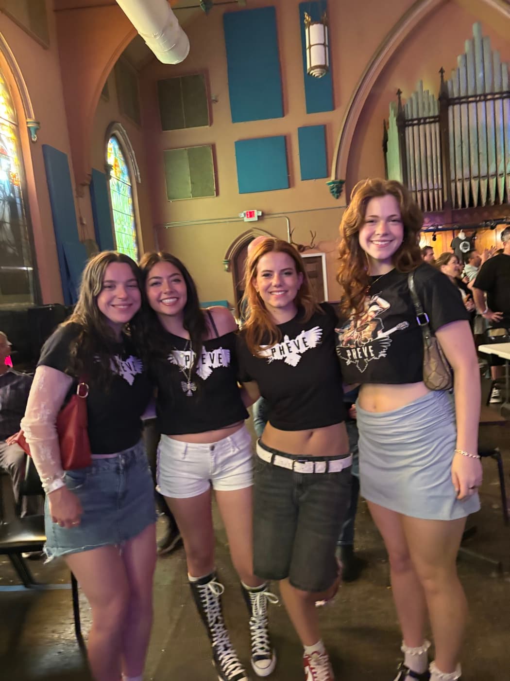 Four fans wearing PHEVE t-shirts at the Rock on the James show
